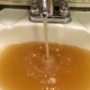 sink filling with rust brown contaminated water in Martin County, KY
